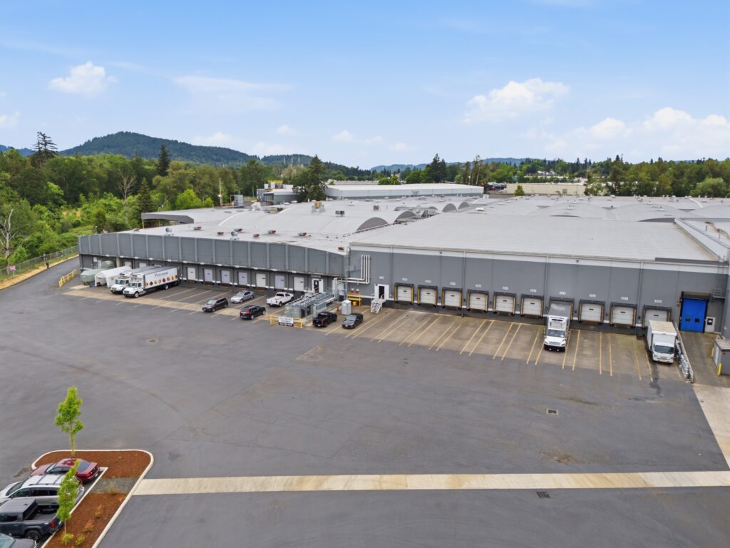 Aerial view of Heritage Cold Storage facility with multiple loading docks and truck parking in Milwaukie, Oregon